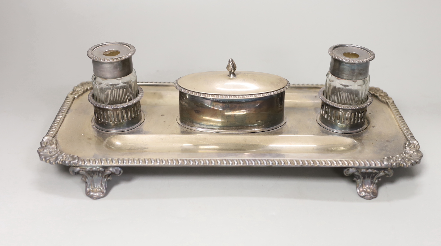 A Regency silver plated inkstand, 29cm wide, 9cm high